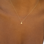 gold heart necklace close up